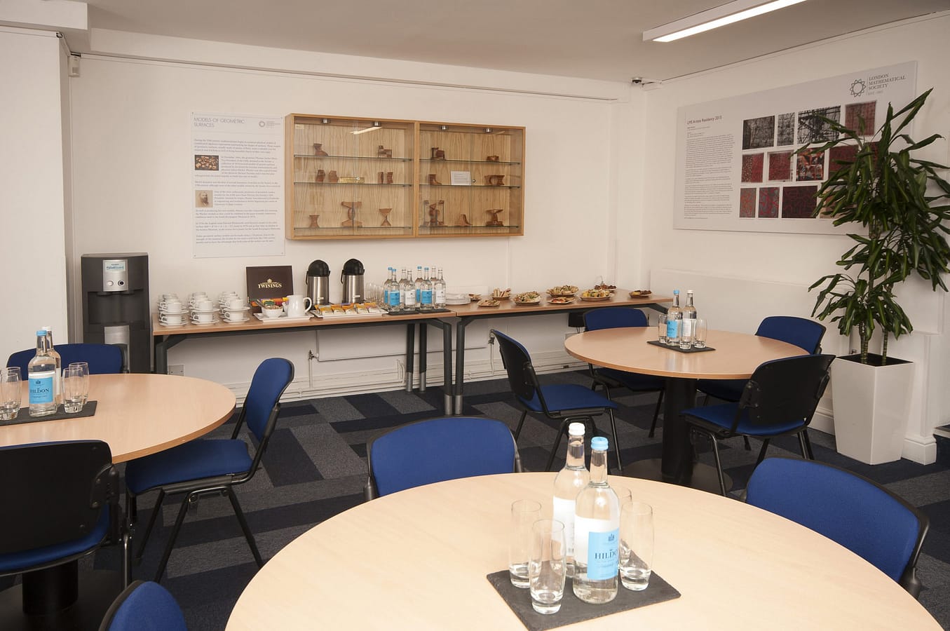 Photo of a catering area in a reception style and food table along the back