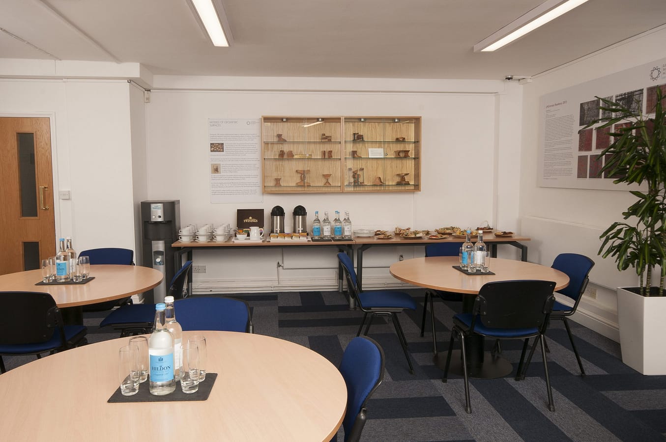 Photo of a catering area in a reception style and food table along the back